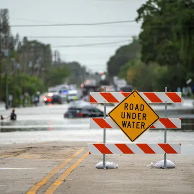 road closed sign due to road under water