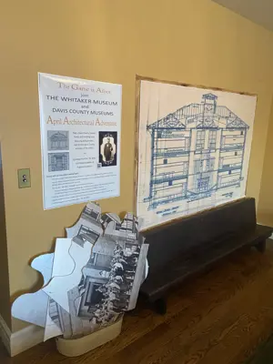 Hands on exhibit about architecture with puzzle like peices and information in the whitaker musem's dining room area