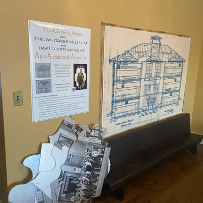 Hands on exhibit about architecture with puzzle like peices and information in the whitaker musem's dining room area