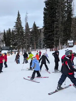Ski school participants with instructors getting ready to leave for the day at Brighton Resort