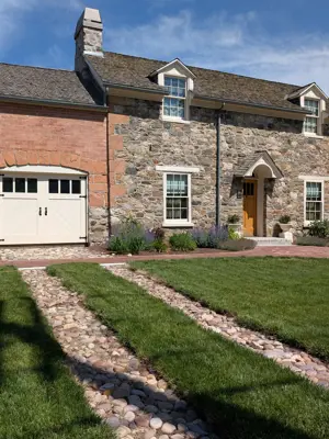 Sunny summer day lighting the well kept exterior of the whiatker home
