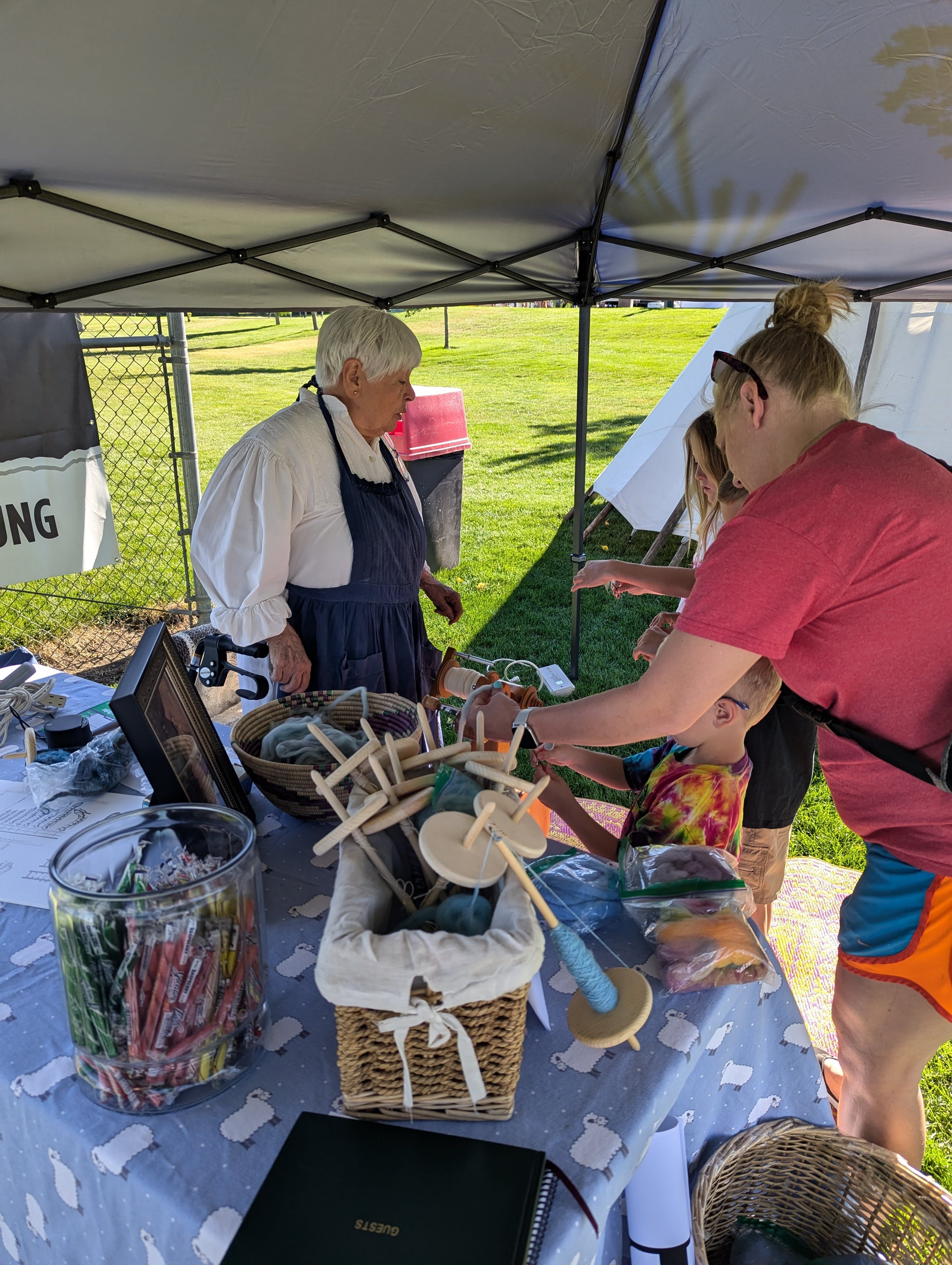 Pop-Up Whitaker Museum at Centerville Freedom Festival with kids and parent visiting ten with activity