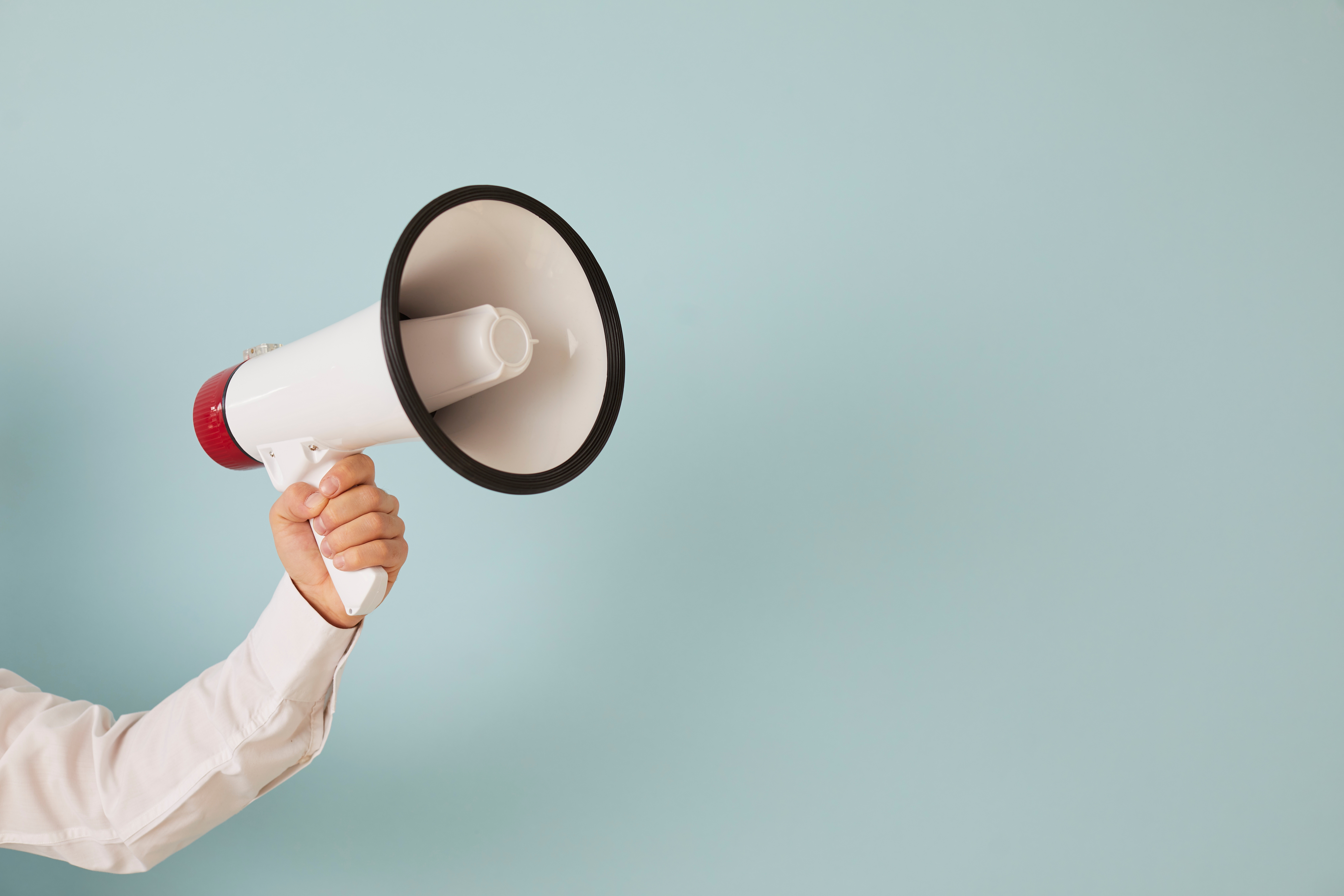 a megaphone being held in a persons hand.