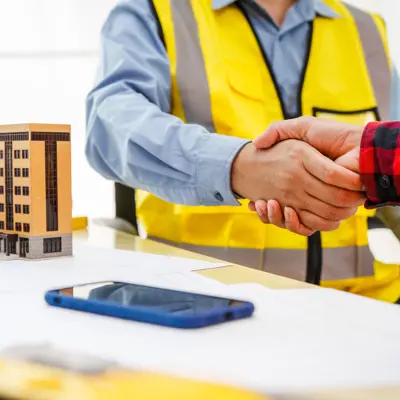 two people shaking hands and agreeing to terms