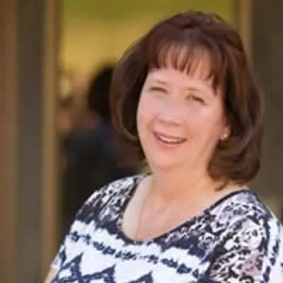Council member Robyn Mecham wearing a white and black blouse. 