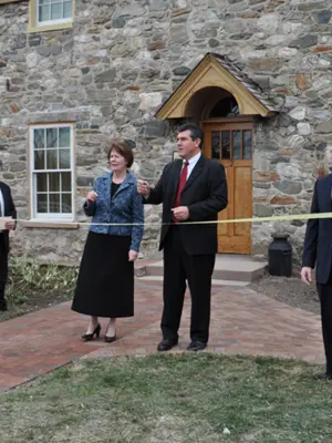 Museum ribbon cutting with museum board members as it is inducted into the city