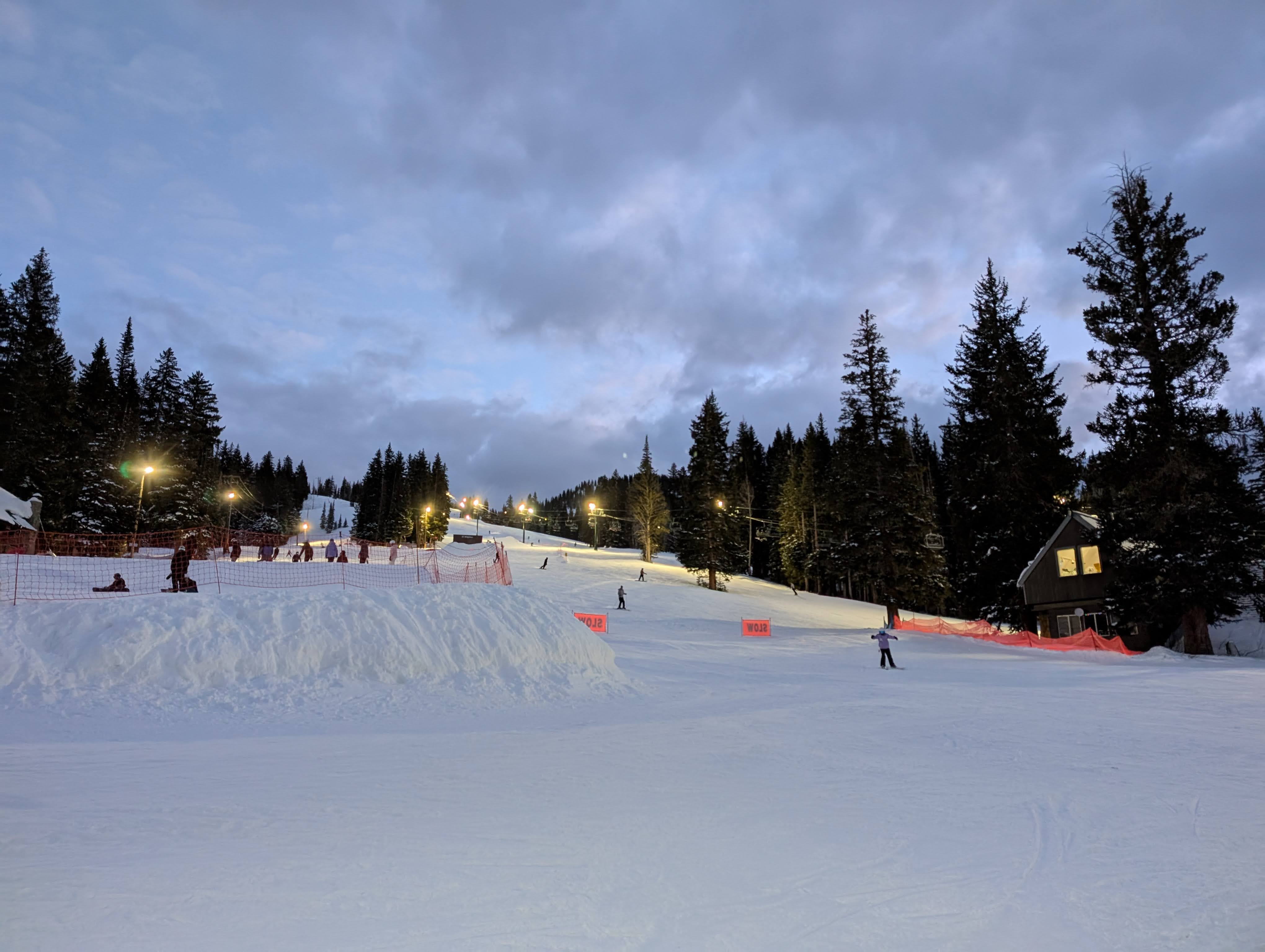 Ski resort groomed under at twilight under the lights