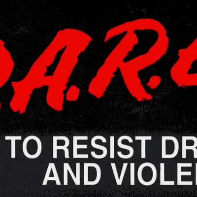 The words DARE that stands for resist drugs and violence